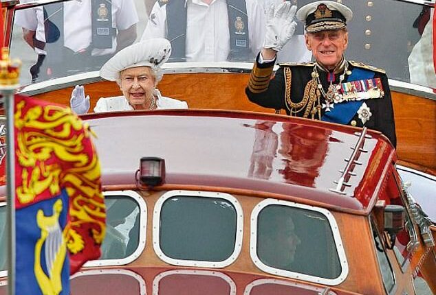 Queen Elizabeth II and Prince Philip wave to onlookers during a pageant in celebration of the Queen's Diamond Jubilee along the River Thames in June 2012. Philip ended up in hospital after he refused to sit down during Queen Elizabeth II's Diamond Jubilee celebrations due to fears he would look like 'Mr Beckham'