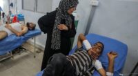 Six children among the dead after Israeli missile 'error' sees strike hit crowds of people queueing for water in Gaza, officials say