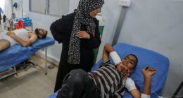 Six children among the dead after Israeli missile 'error' sees strike hit crowds of people queueing for water in Gaza, officials say