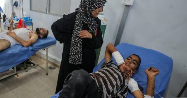Six children among the dead after Israeli missile 'error' sees strike hit crowds of people queueing for water in Gaza, officials say