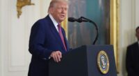 Six months into term, Trump touts 'revived' US as approval dips