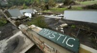 A Camp Mystic sign is seen near the entrance to the establishment along the banks of the Guadalupe River in Hunt, Texas, Saturday, July 5, 2025, after a flash flood swept through the area. (AP Photo/Julio Cortez)