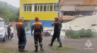 Emergency personnel at a kindergarten damaged by an earthquake.