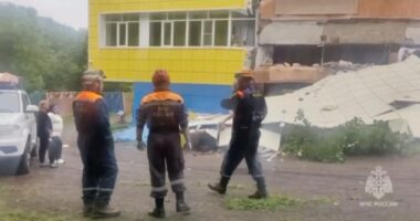 Emergency personnel at a kindergarten damaged by an earthquake.