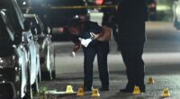 Forensic investigators collecting evidence at a mass shooting scene.