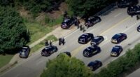 Aerial view of police cars and officers responding to an active shooter near Emory University.
