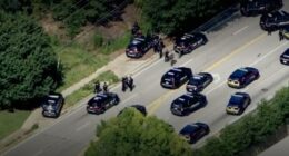 Aerial view of police cars and officers responding to an active shooter near Emory University.