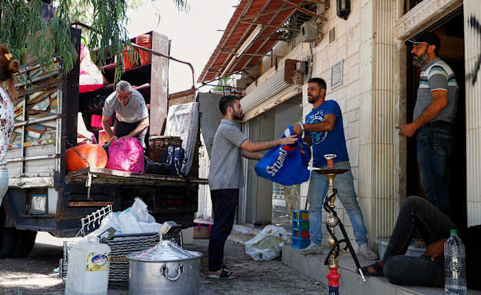 Alawite families flee Damascus suburb after violence and eviction threats
