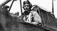 Black and white photo of Donald McPherson, America's last living ace pilot from World War II, in the cockpit of his plane.