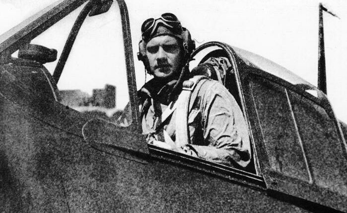 Black and white photo of Donald McPherson, America's last living ace pilot from World War II, in the cockpit of his plane.