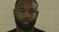 Mugshot of a man with a beard.