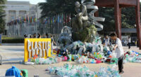 Artist drowns sculpture in plastic waste in front of the UN during plastic pollution treaty talks