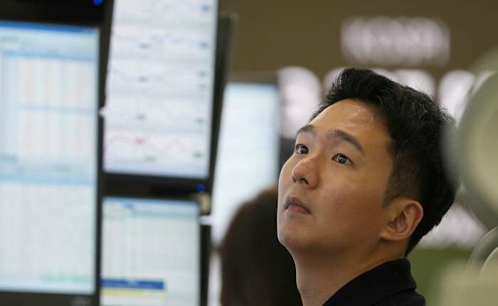 Asian shares are mixed after stocks add a bit to their records on Wall Street