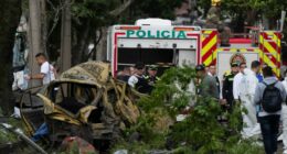 Aftermath of a vehicle explosion in Cali, Colombia; emergency responders and investigators at the scene.