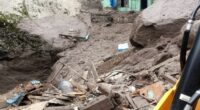 Building damaged by flash floods in a mountainous village.