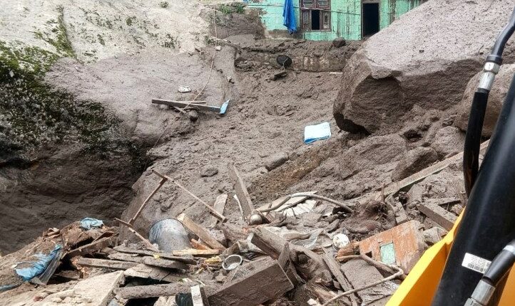 Building damaged by flash floods in a mountainous village.