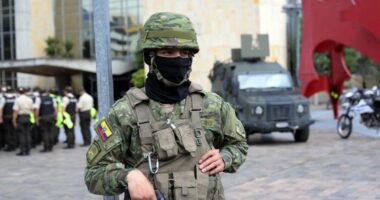 Military police guarding a building before a presidential debate.