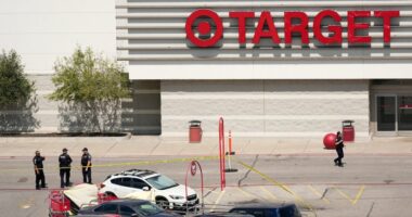 Police officers at a Target store crime scene.