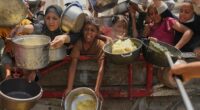 Baby girl killed with parents in Gaza airstrike as Israelis urge a mass protest over the war