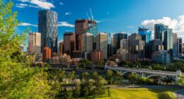 Calgary skyline with a bridge and river.