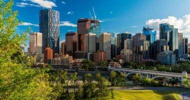 Calgary skyline with a bridge and river.