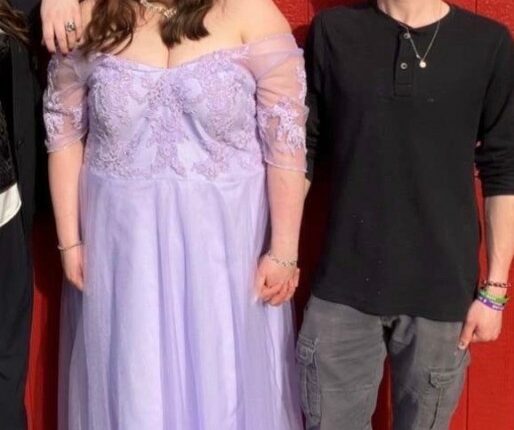 Screenshot of a couple posing for a photo.