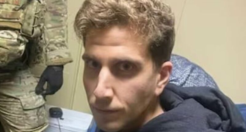 Bryan Kohberger's stone-faced glare at officer at his parents' home