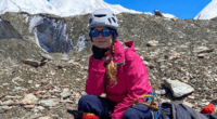 Woman resting during a mountain climb.