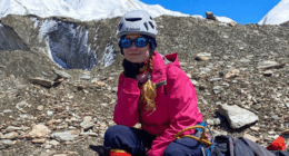 Woman resting during a mountain climb.