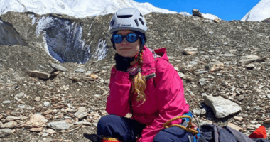 Woman resting during a mountain climb.