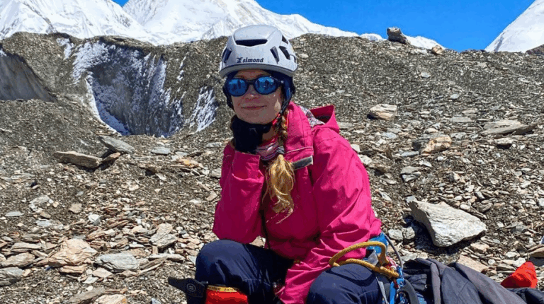 Woman resting during a mountain climb.