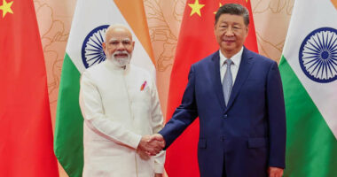 China's Xi and India's Modi vow to resolve border differences at meeting in Tianjin