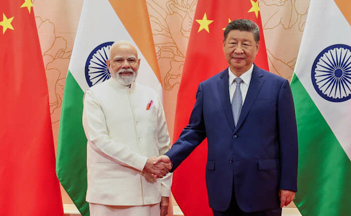 China's Xi and India's Modi vow to resolve border differences at meeting in Tianjin