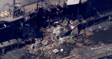 Aerial view of a damaged industrial building.