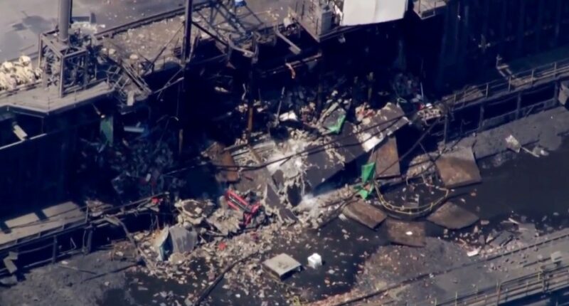 Aerial view of a damaged industrial building.