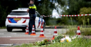 Flowers left at a roadside crime scene.