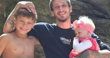 Photo of a father with his two young children.