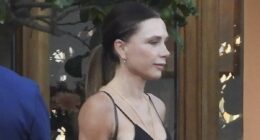 David Beckham cheekily grabs wife Victoria's bum during family meal