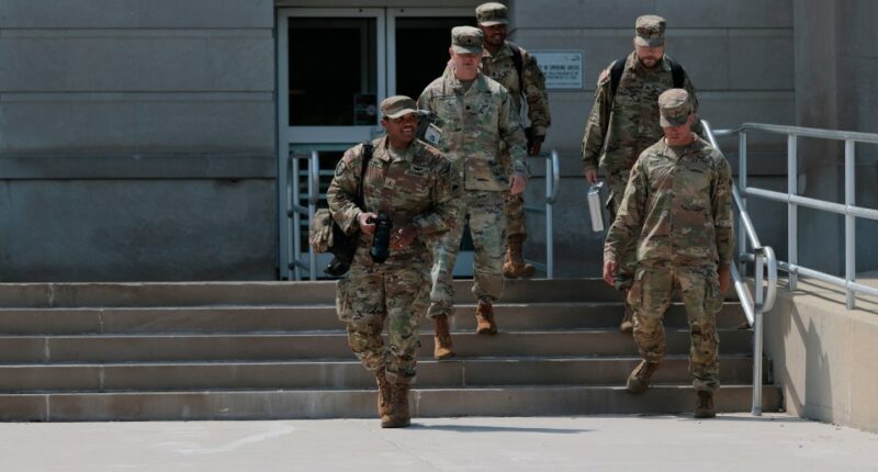 National Guard members descending steps.