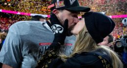 Travis Kelce and Taylor Swift kissing after an AFC Championship game.