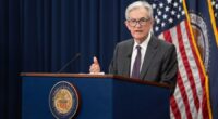 Dow hits record high as stocks rally on Powell speech, rate cut hopes