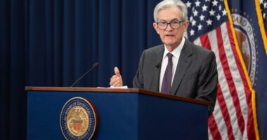 Dow hits record high as stocks rally on Powell speech, rate cut hopes