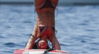 Dua Lipa showcases her impressive yoga moves on a paddle board