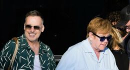 Elton John holds hands with husband David Furnish