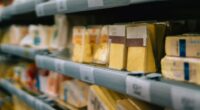 Variety of cheese on supermarket shelves.