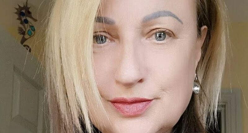 Photo of a woman with blonde and brown hair.