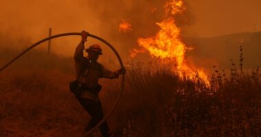 Fast-growing brush fire forces thousands to evacuate north of Los Angeles