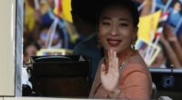 Princess Bajrakitiyabha Mahidol waving from a car.