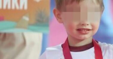 Photo of Vladimir Putin's youngest son with his face blurred.