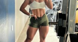 Woman taking a selfie in a gym.